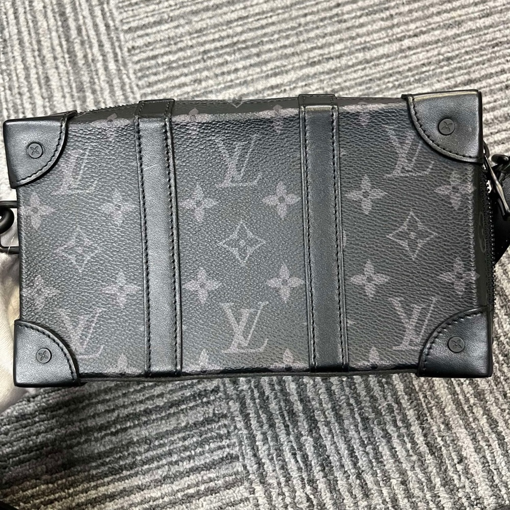 Louis Vuitton soft Trunk Wallet on Strap Monogram Eclipse.
It comes with strap.